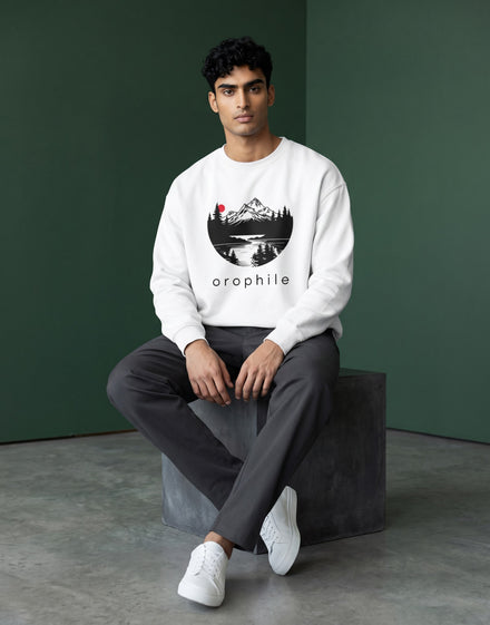 Tribe Neo 91 white oversized sweatshirt featuring a circular mountain landscape graphic with a red sun on a male model.
