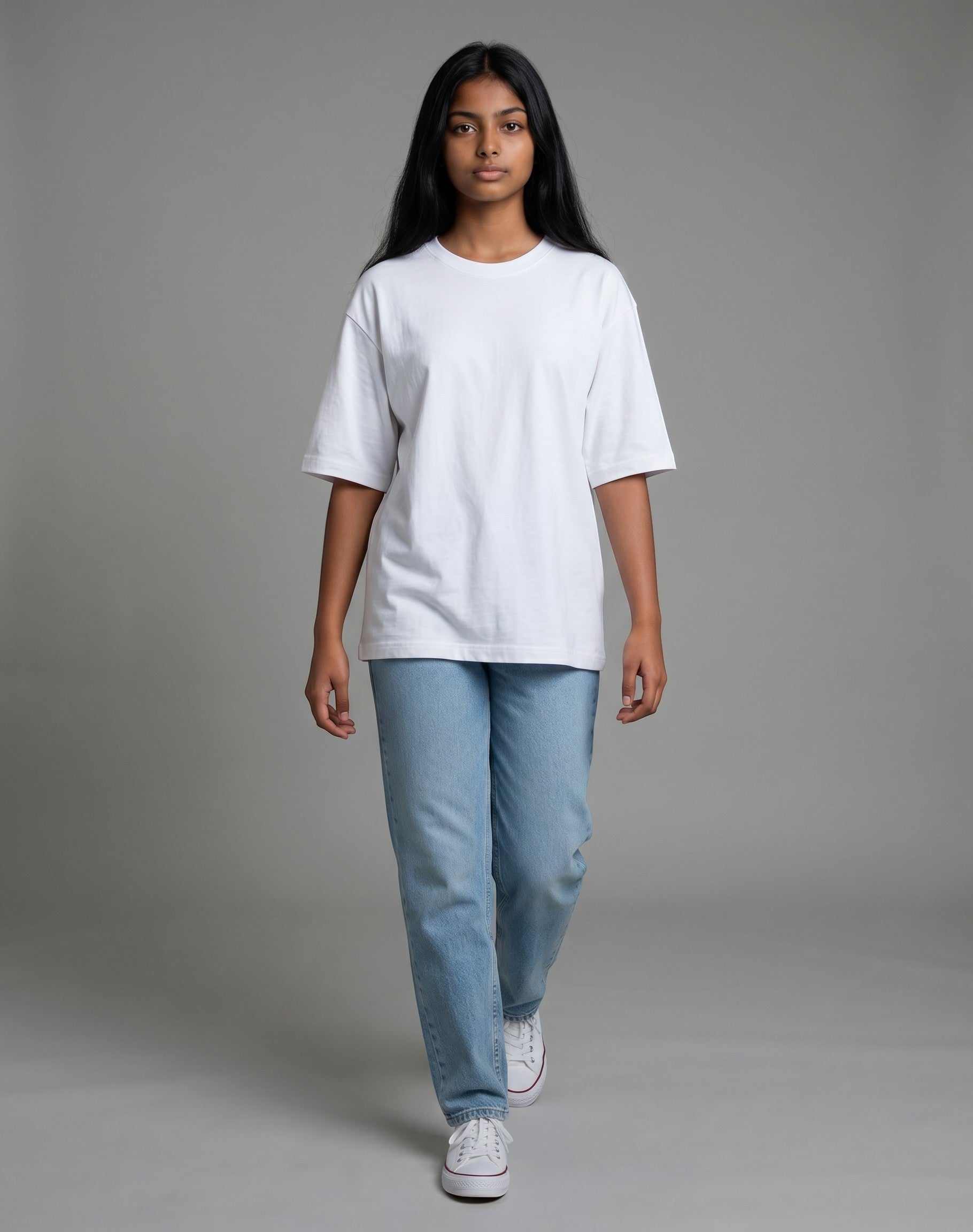 Model wearing a Tribe Neo 91 white heavyweight cotton oversized t-shirt with dropped shoulders and light blue jeans