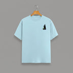 Witch Cauldron graphic t-shirt on BABY BLUE unisex 100% cotton crew neck, subtle charming witch and cauldron graphic on chest, unique eye-catching magic detail, DTG print 300 DPI, 180 GSM breathable soft fabric