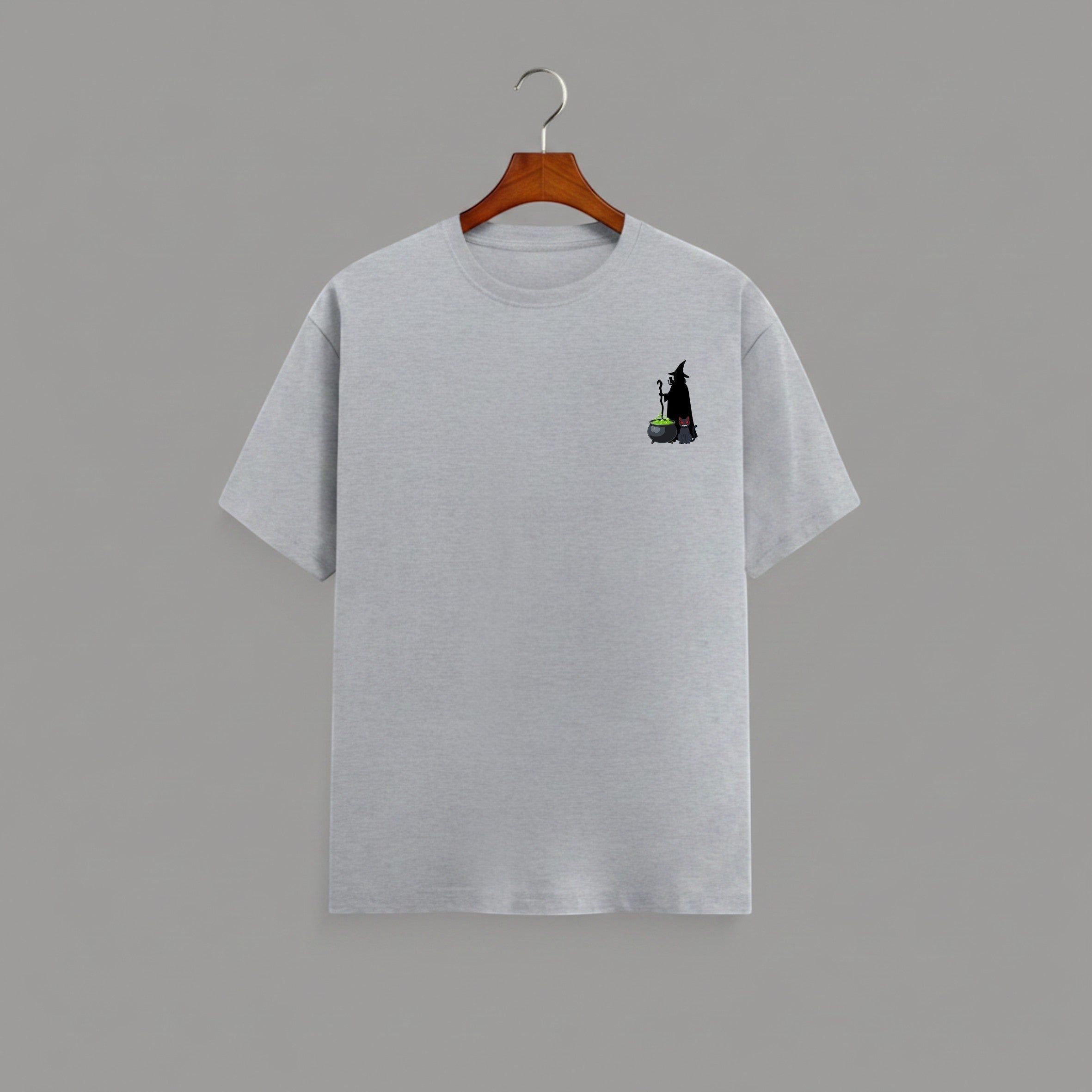Witch Cauldron graphic t-shirt on GREY unisex 100% cotton crew neck, subtle charming witch and cauldron graphic on chest, unique eye-catching magic detail, DTG print 300 DPI, 180 GSM breathable soft fabric