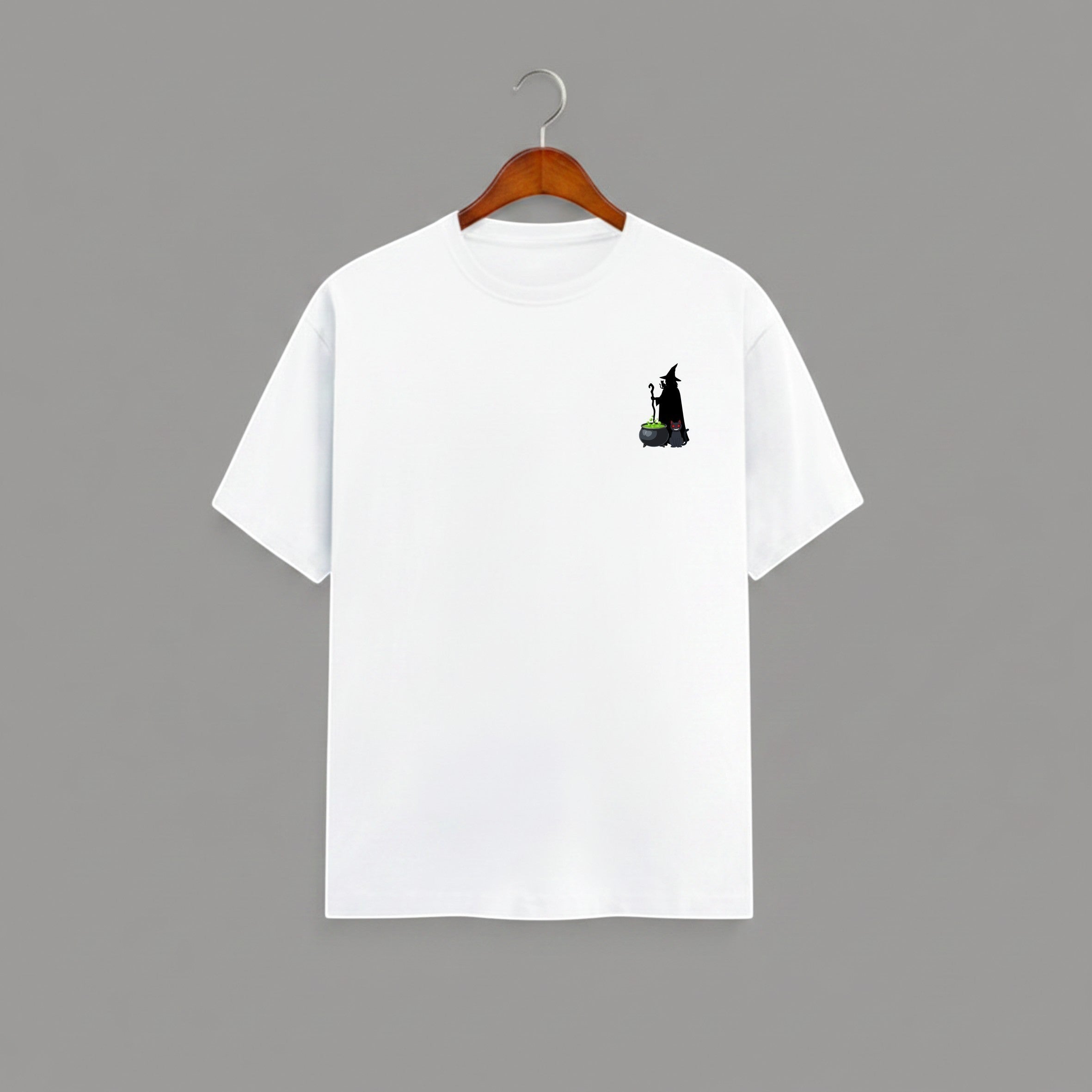 Witch Cauldron graphic t-shirt on WHITE unisex 100% cotton crew neck, subtle charming witch and cauldron graphic on chest, unique eye-catching magic detail, DTG print 300 DPI, 180 GSM breathable soft fabric