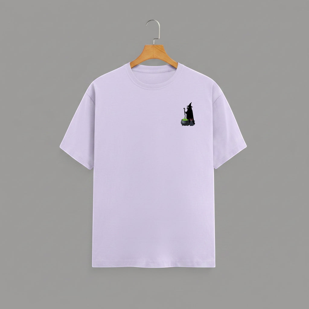 Witch Cauldron graphic t-shirt on LAVENDER unisex 100% cotton crew neck, subtle charming witch and cauldron graphic on chest, unique eye-catching magic detail, DTG print 300 DPI, 180 GSM breathable soft fabric