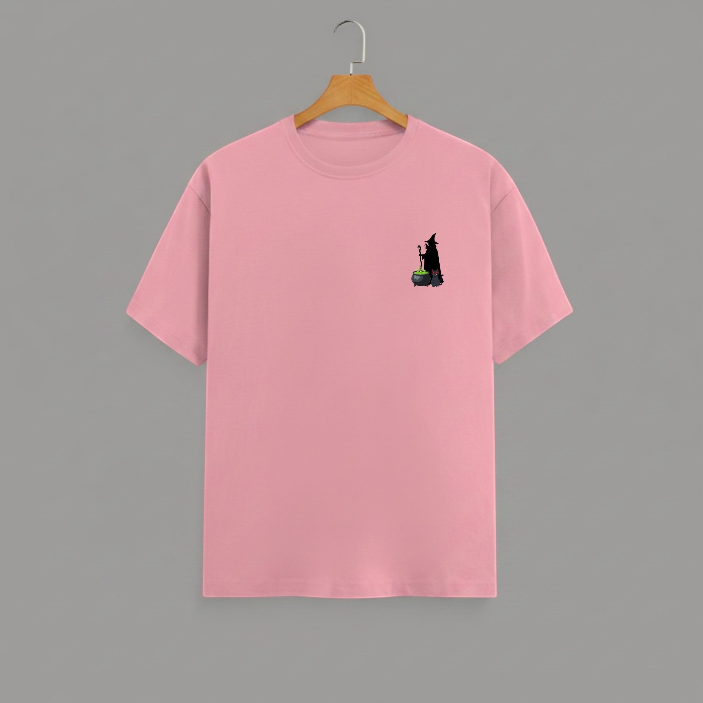Witch Cauldron graphic t-shirt on FLAMINGO unisex 100% cotton crew neck, subtle charming witch and cauldron graphic on chest, unique eye-catching magic detail, DTG print 300 DPI, 180 GSM breathable soft fabric