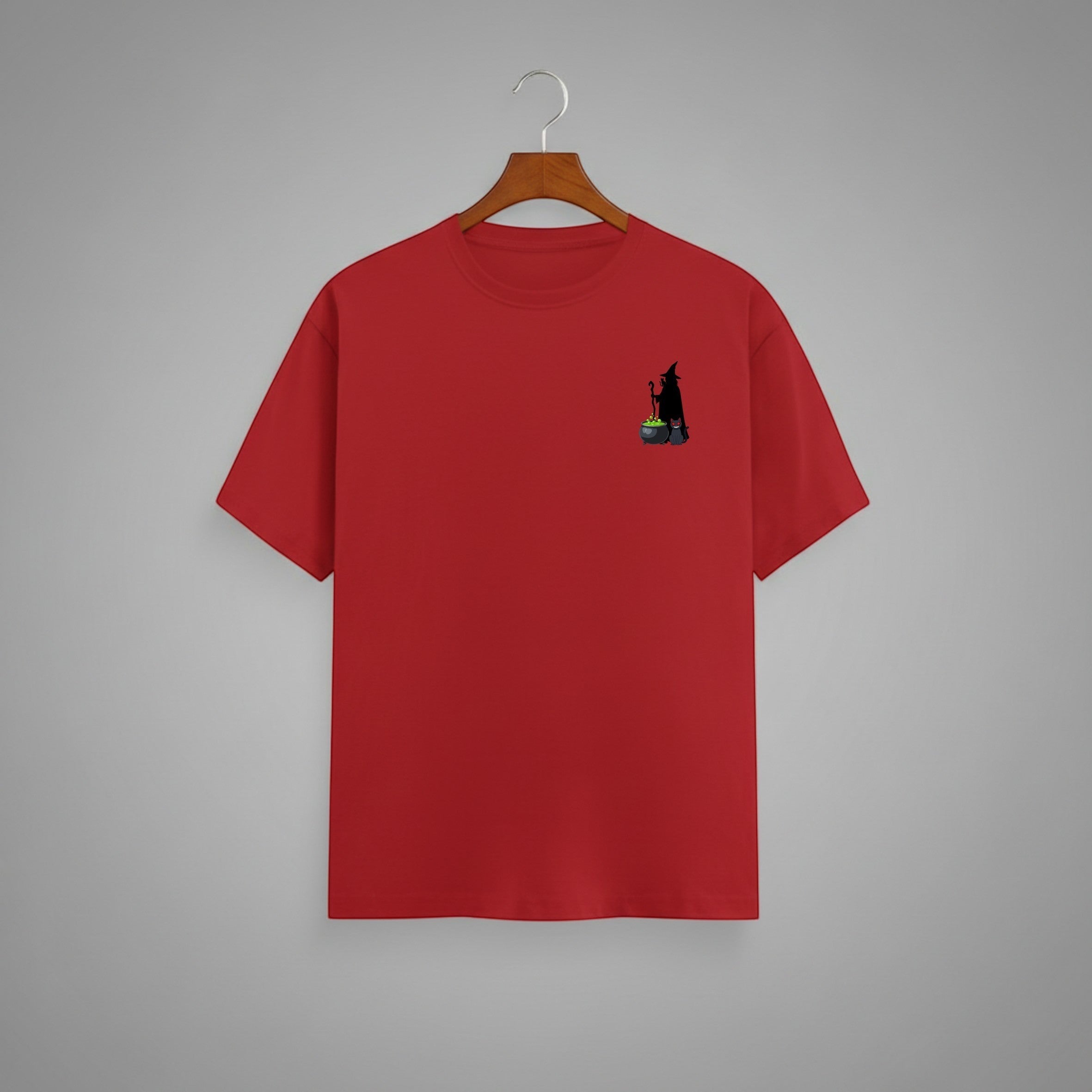 Witch Cauldron graphic t-shirt on RED unisex 100% cotton crew neck, subtle charming witch and cauldron graphic on chest, unique eye-catching magic detail, DTG print 300 DPI, 180 GSM breathable soft fabric